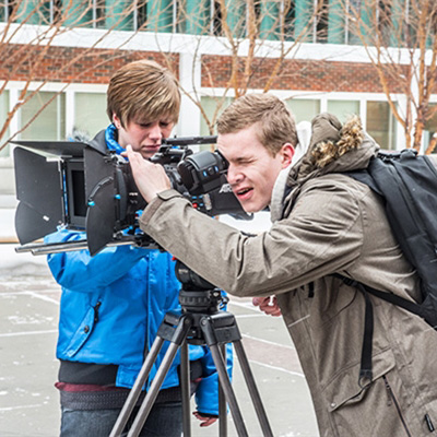Two students get outdoor b-roll footage of SAIT's campus