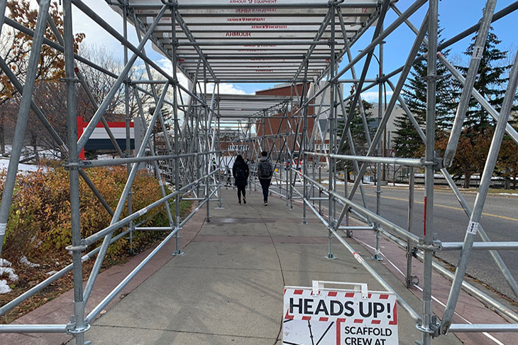 Scaffolding over the pathway leading from the SAIT/AUA/Jubilee Calgary CTrain station up the hill to SAIT's main campus
