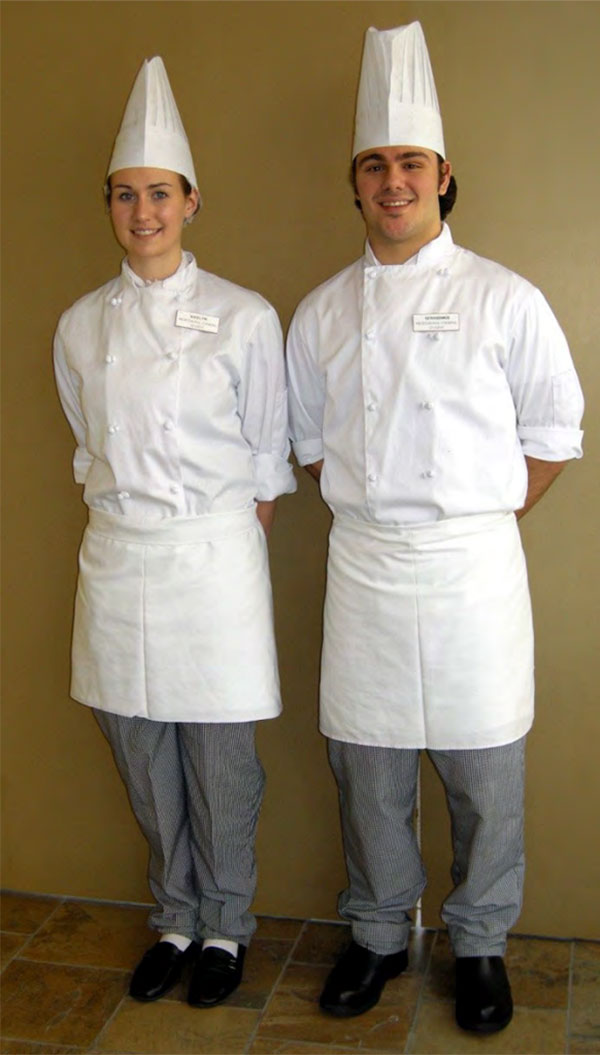 Two Culinary Arts students wearing their uniforms.