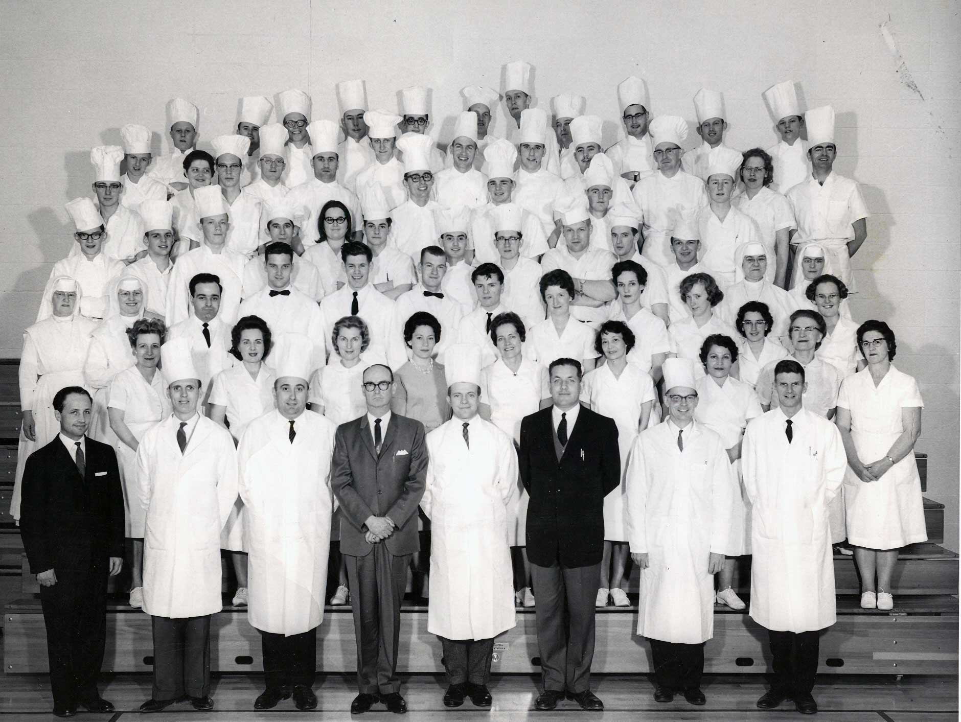 A group photo of students and instructors from the Commercial Cooking program, 1963