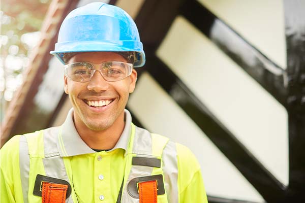 man in construction gear smiling