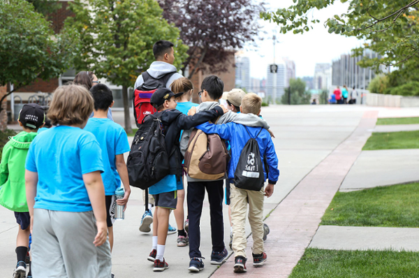 Young boys walking on campus